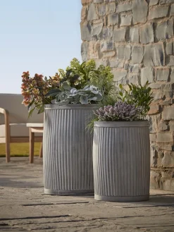 Two zinc Barrel Planters